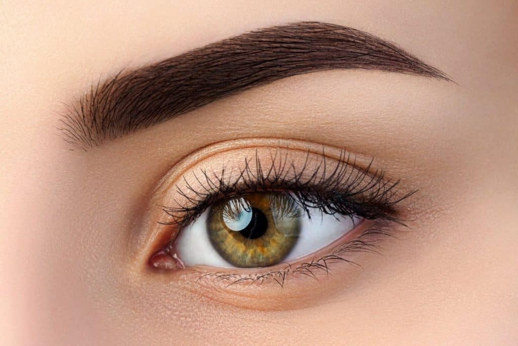up close shot of woman's eye with perfect ombre powder brows